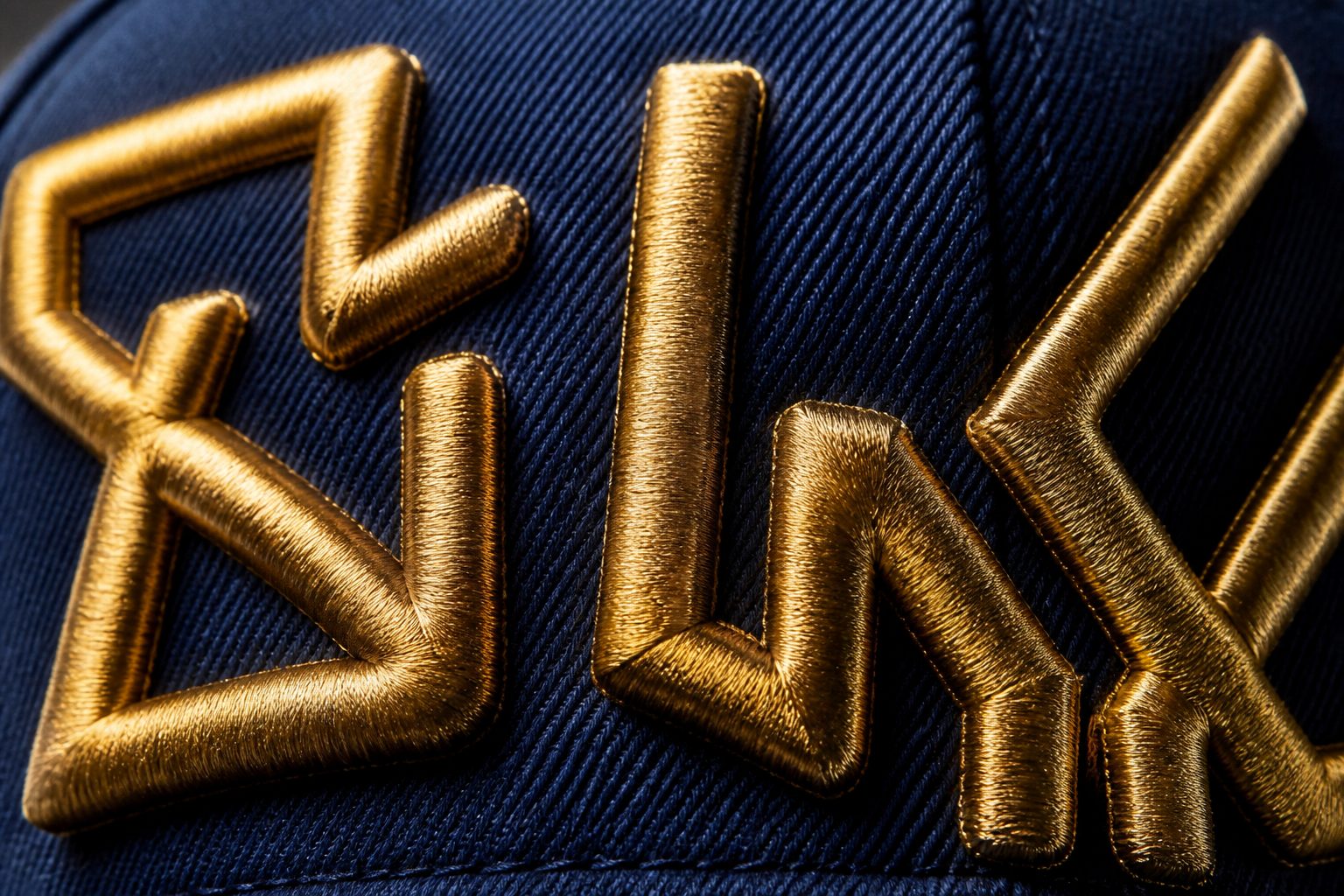 Macro photo of raised 3D puff embroidered patch stitching