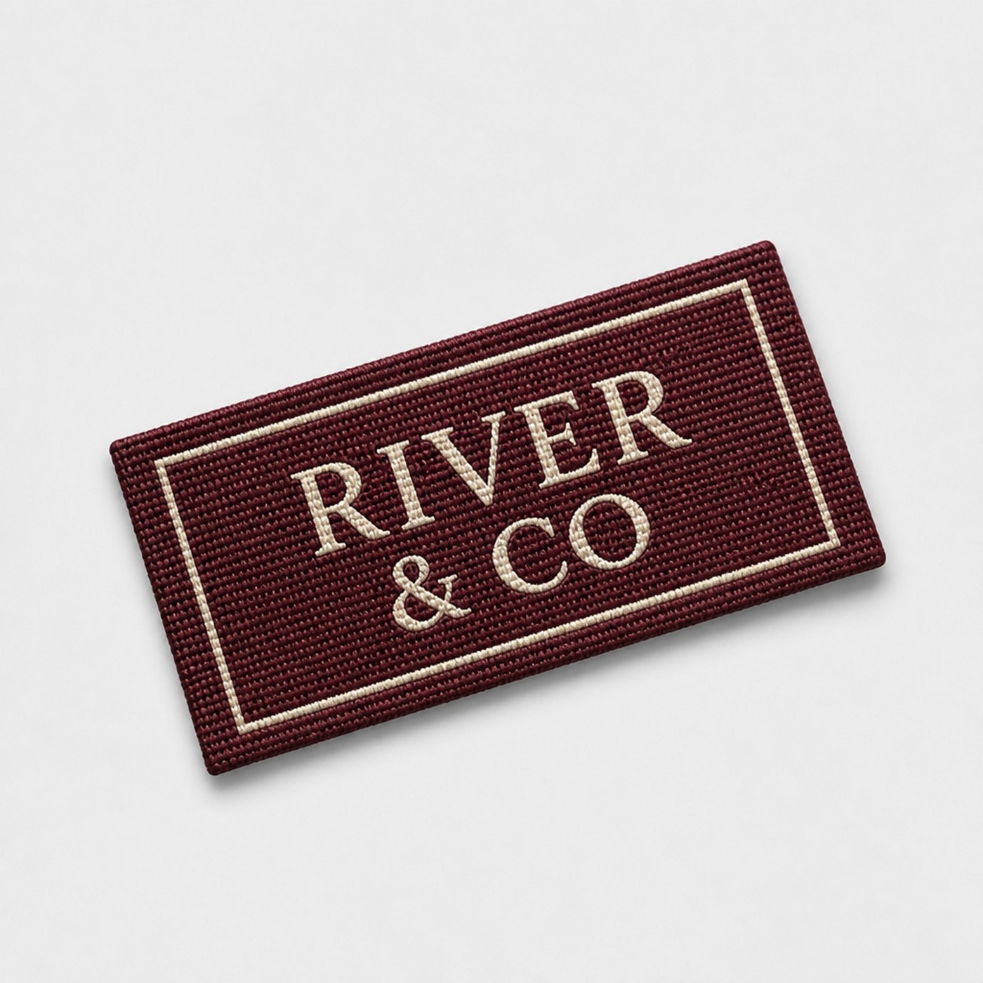 Custom burgundy damask woven clothing label